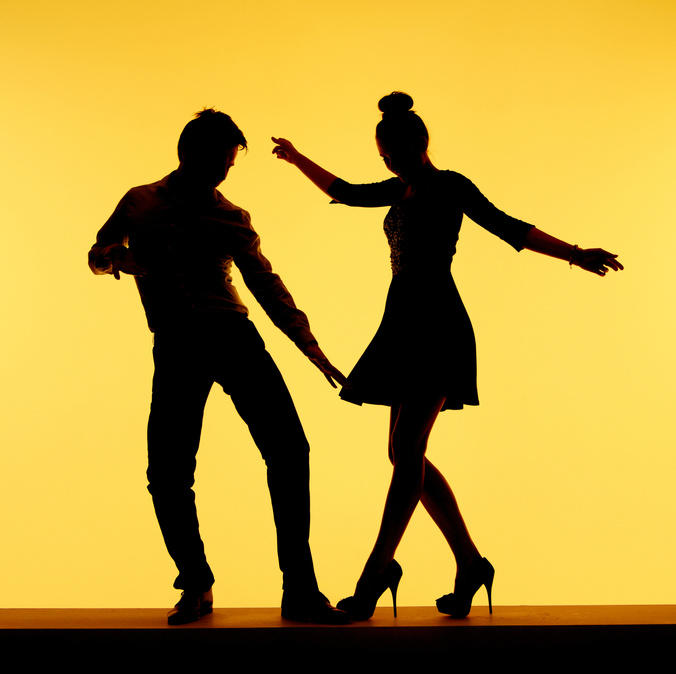 Two silhouettes dancing. Find your next dance partner on buddypassgo.com. 